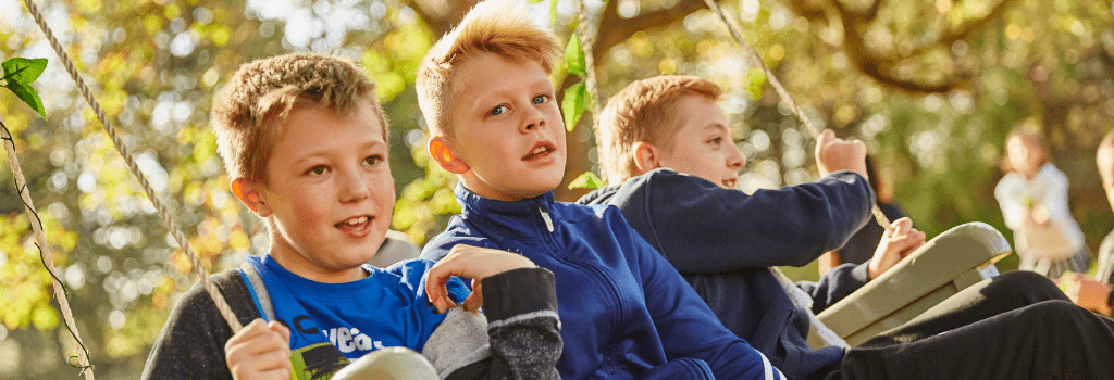 young boys on swing